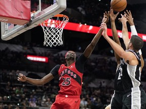 Toronto Raptors forward Chris Boucher (25) goes after a rebound during the second half against the San Antonio Spurs.