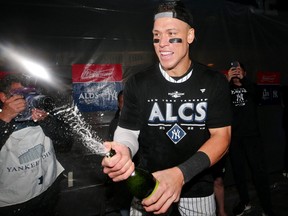 New York Yankees right fielder Aaron Judge celebrates in the clubhouse after their win against the Cleveland Guardians in Game 5 of the ALDS for the 2022 MLB Playoffs at Yankee Stadium, Oct. 18, 2022.