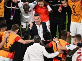 Canada's English coach John Herdman speaks to his players after the Qatar 2022 World Cup Group F football match between Belgium and Canada at the Ahmad Bin Ali Stadium in Al-Rayyan, west of Doha on November 23, 2022.