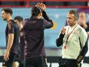 Qatar, 26 November 2022 German coach Hans Dieter Flick (right) faces forward Leroy Sane during a training session at the Al Shamal Stadium in Al Shamal, north of Doha, on the eve of the 2022 World Cup football match against Spain Speaking to and Germany.