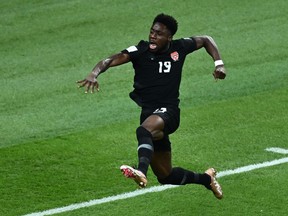 Canada's Alphonso Davies celebrates scoring his team's first goal during the Qatar 2022 World Cup Group F football match between Croatia and Canada at the Khalifa International Stadium in Doha on November 27, 2022.