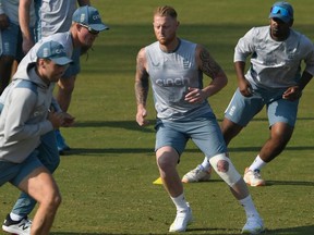 Englands captain Ben Stokes (2R) warms up along with teammates during a training session ahead of their first cricket Test match against Pakistan, at the Rawalpindi Cricket Stadium in Rawalpindi on November 28, 2022.