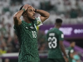 Saudi Arabia’s Salem Al-Dawsari holds his head after missing a chance to score during the World Cup group C soccer match between Poland and Saudi Arabia, at the Education City Stadium in Al Rayyan , Qatar, Nov. 26, 2022.