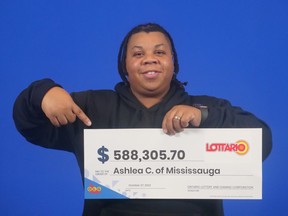 Ashlea Carter of Mississauga shows off her lottery winnings.