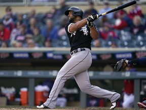 Chicago White Sox's Jose Abreu hits an RBI-double during the eighth inning of a baseball game against the Minnesota Twins, on Thursday, Sept. 29, 2022, in Minneapolis.