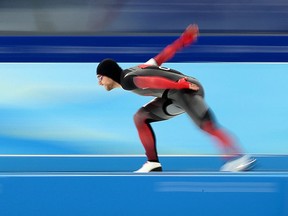 Athlete Laurent Dubreuil of Canada competes in the men's 1,000m speed skating race at the National Speed Skating Oval (Ice Ribbon) as part of the 2022 Winter Olympic Games.