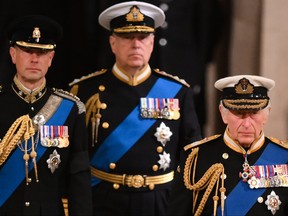 King Charles lll, Prince Andrew, Duke of York and Prince Edward, Earl of Wessex attend a vigil, following the death of Queen Elizabeth ll, inside Westminster Hall on Sept. 16, 2022 in London.