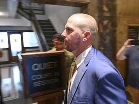 Former Kansas City Chiefs assistant coach Britt Reid walks to a courtroom at the Jackson County Courthouse on Sept. 12, 2022, in Kansas City, Mo. Reid is scheduled to be sentenced on Friday, Oct. 28, 2022, for driving drunk and speeding before he hit two parked cars last year, leaving a 5-year-old girl with a serious brain injury.