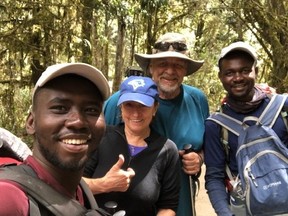 Betty Motton and Dennis Robinson with their guides at the start of their trek up Mount Kilimanjaro