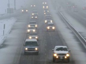 In this file photo taken on Dec. 28, 2006, traffic begins to back up as snow falls on U.S. Highway 36 in Louisville, Col.