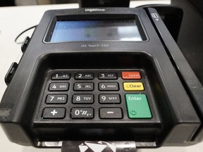 A credit card machine is shown at Mercedes-Benz Stadium during a tour, in Atlanta.