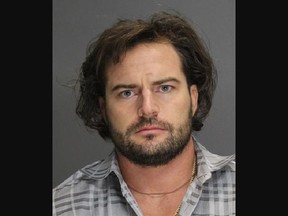 Mug shot of a man with facial hair.