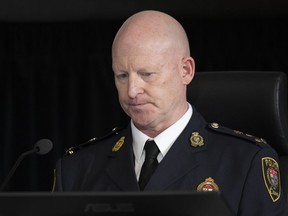 Ottawa Police Service interim Police Chief Steve Bell appears at the Public Order Emergency Commission in Ottawa, Oct. 24, 2022. Ottawa's interim police chief says his force is investigating allegations that officers leaked intelligence to organizers of last winter's "Freedom Convoy" protest.
