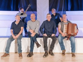 Front L-R: John Lethbridge (Lefty), Jon Cleave (Cleavie), John McDonnell (Johnny Mac) and Jason Nicholas (with Accordion) Back Row L-R: Toby Lobb (with guitar) and Jeremy Brown