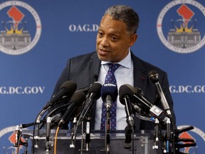 District of Columbia Attorney General Karl Racine discusses his office's investigation of misconduct by the NFL's Washington Commanders and team owner Dan Snyder and the filing of a civil lawsuit by the city of Washington against Snyder and the football team, during a news conference in Washington, U.S., November 10, 2022.