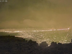 Thgis image provided by the U.S. Geological Survey Hawaiian Volcano Observatory shows Hawaii's Mauna Loa, the world's largest active volcano, has started to erupt, prompting volcanic ash and debris to fall nearby.