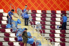 Japanese fans clear rubbish from the stands during the FIFA World Cup Qatar 2022 Group E match between Germany and Japan at Khalifa International Stadium on Nov. 23, 2022 in Doha, Qatar.
