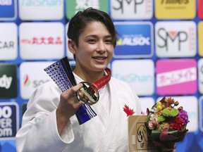 Gold medalist Christa Deguchi of Canada poses for a photo during the award ceremony of the women's -57 kilogram class of the World Judo Championships in Tokyo, Tuesday, Aug. 27, 2019.