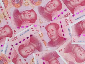Chinese one-hundred yuan banknotes are arranged for a photograph in Hong Kong, China, on Thursday, April 23, 2020.