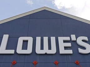 Lowe's store signage is shown, in Hialeah, Fla., Wednesday, June 29, 2016. Lowe's announced Thursday it's selling its Canadian retail arm to a private equity firm.