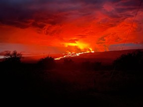 This image released by the US Geological Survey (USGS) on Nov. 29, 2022, shows Mauna Loa Volcano in Hawaii erupting from the Northeast Rift Zone sending lava flows to the north downslope toward Saddle Road.