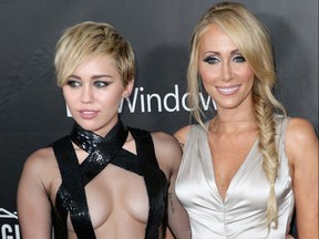 Miley Cyrus and Tish Cyrus attend amfAR LA Inspiration Gala honoring Tom Ford at Milk Studios on Oct. 29, 2014 in Hollywood, Calif.