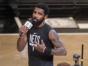 Brooklyn Nets' Kyrie Irving speaks before the team's NBA basketball game against the New Orleans Pelicans, Wednesday, Oct. 19, 2022, in New York.