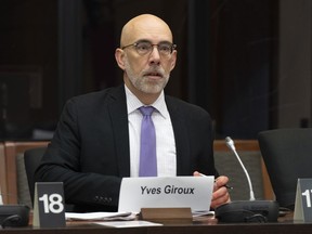 Parliamentary Budget Officer Yves Giroux waits to appear before appearing at the Senate Committee on National Finance in Ottawa, Oct. 25, 2022.