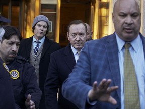 American actor Kevin Spacey, centre, leaves the Daniel Patrick Moynihan Court House in New York City, Oct. 20, 2022. A film museum in Italy's city of Turin said Thursday, Nov. 3 that Spacey will receive a lifetime achievement award and teach a master class there early next year.