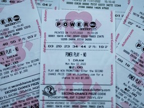 In this photo illustration, tickets for the upcoming Powerball lottery are seen on Nov. 7, 2022 in Washington, D.C.