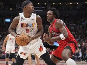 Toronto Raptors forward O.G. Anunoby defends against Miami Heat forward Jimmy Butler  during the first half at Scotiabank Arena in Toronto, Nov. 16, 2022.