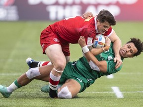 Ireland's Conor Phillips tackles Canada's Nick Allen during HSBC Canada Sevens quarter finals rugby action, in Edmonton, on Sunday, Sept. 26, 2021. Canadian rugby player Allen was hospitalized in Indonesia with a traumatic brain injury after a car crash last week in Bali, Rugby Canada said.THE CANADIAN PRESS/Jason Franson