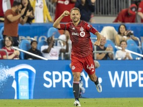 Toronto FC defender Domenico Criscito (44) celebrates after scoring a goal against the New England Revolution during the second half at BMO Field.