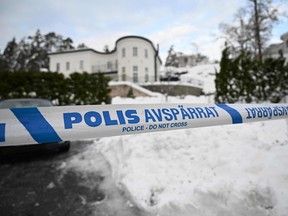 Police secure the area at a house where the Sweden's security service Sapo arrested two people on suspicions of espionage, in the Stockholm area, on November 22, 2022.