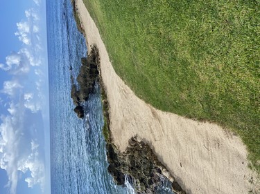 The sliver of a bunker that separates you fromthe sea if you hit it short at the fifth.