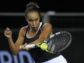 Canada's Leylah Fernandez plays a return to Switzerland's Belinda Bencic on the 4th day of the Billie Jean King Cup tennis finals at the Emirates Arena in Glasgow, Scotland Friday, Nov. 11, 2022.