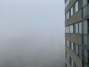 Fog hangs over Toronto in a view from a condominium on Thursday, Nov. 24, 2022.