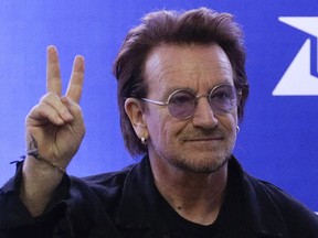FILE - U2 singer Bono gestures as he attends the launching of the first blood by drone delivery service in the country at the Philippine Red Cross headquarters in suburban Mandaluyong, east of Manila, Philippines on Tuesday Dec. 10, 2019. Bono opened his book tour for his bestselling "Surrender: 40 Songs, One Story," on Wednesday, Nov. 2, 2022, to thousands of screaming fans at Manhattan's Beacon Theatre.