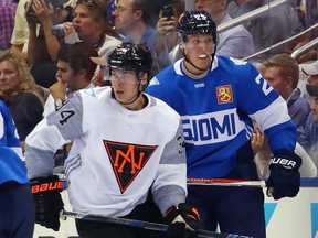 Patrik Laine of Team Finland skates against Auston Matthews of Team North America during the World Cup of Hockey at the Air Canada Centre on September 18, 2016 in Toronto.