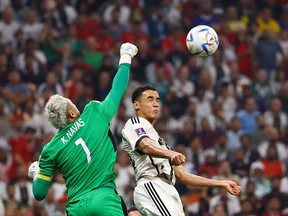 Costa Rica's Keylor Navas makes a save in front of Germany's Jamal Musiala.
