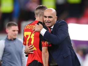 Roberto Martinez and Timothy Castagne of Belgium look dejected after their sides' elimination from the tournament.