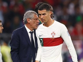 Portugal's Cristiano Ronaldo with coach Fernando Santos after being substituted.