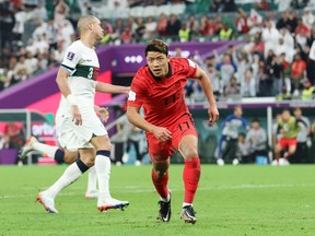 Heechan Hwang of Korea Republic celebrates after scoring the team's second goal against Portugal.