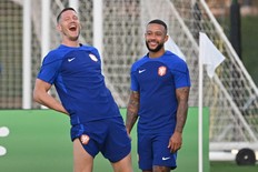 Netherlands' forwards Wout Weghorst (left) and Memphis Depay take part in a training session.