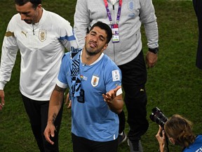 Uruguay forward Luis Suarez reacts at the end of the Qatar 2022 World Cup Group H football match between Ghana and Uruguay.