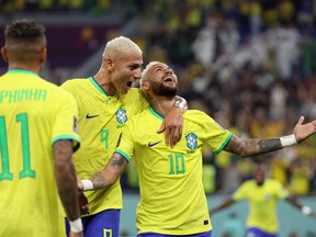 Neymar of Brazil celebrates after scoring the team's second goal against South Korea.