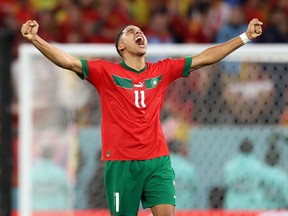 Abdelhamid Sabiri of Morocco celebrates scoring the team's first penalty in the penalty shootout against Spain.