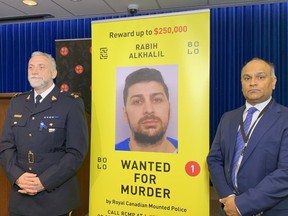 Coquitlam RCMP's Darren Carr with CFSEU chief Manny Mann on Oct. 18, 2022. A $250,000 reward has been offered for the capture of fugitive killer Robby Alkhalil.