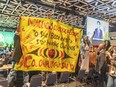 Members of West Coast Indigenous tribes protest during Prime Minister Justin Trudeau's opening remarks for COP15 at the Palais des congrès in Montreal, Dec. 6, 2022.