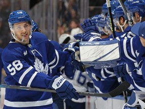 Michael Bunting of the Toronto Maple Leafs celebrates a goal against the Tampa Bay Lightning with teammates on the bench in the first period during an NHL game at Scotiabank Arena on Dec. 20, 2022.